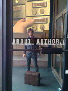 ian with a super 8 projector in Silas Finch's studio lobby